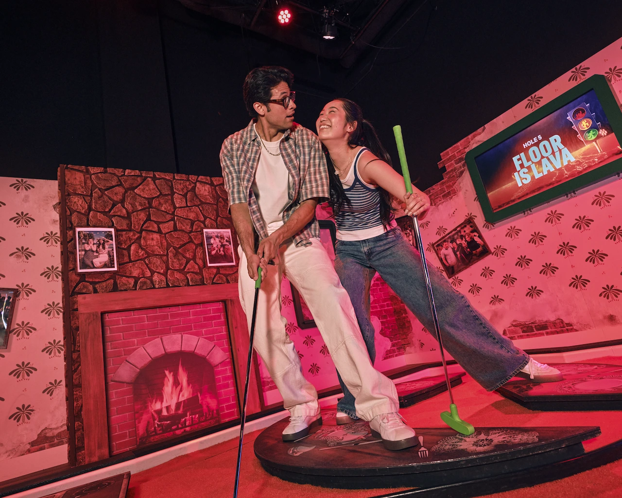 Couple playing Top 9 mini-golf