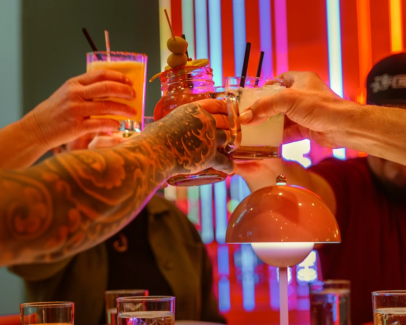 Group cheering drinks at Netflix Bites